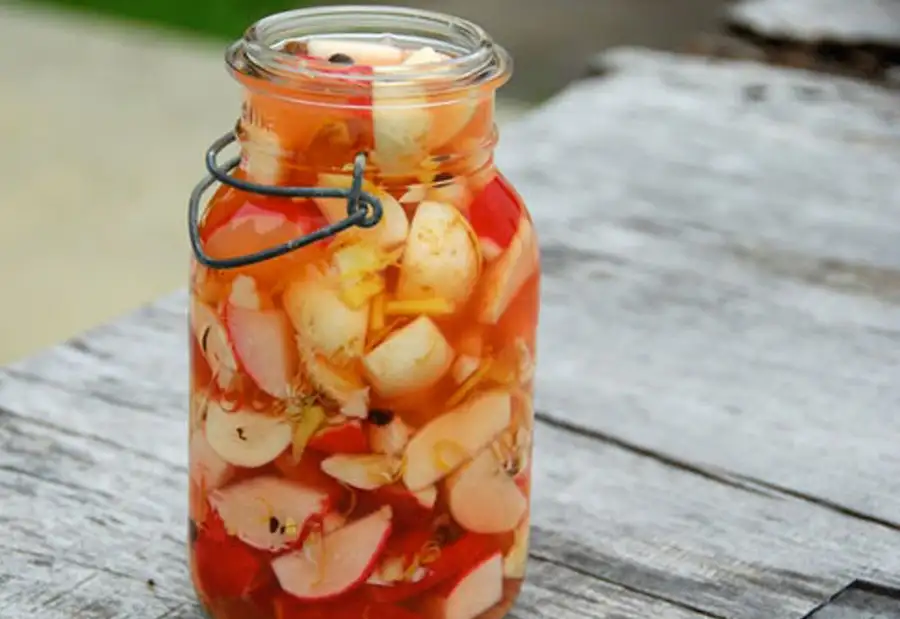 photo of pickle jar with pickled fruits and vegetables