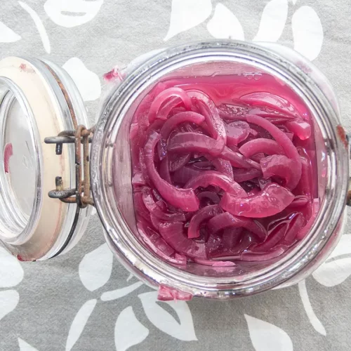 pickled red onions in a jar