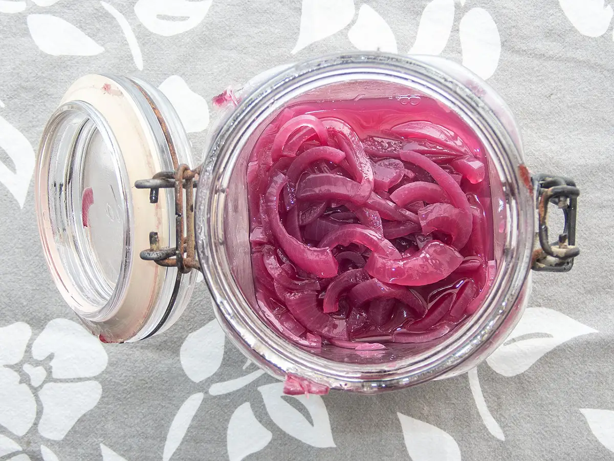 pickled red onions in a jar