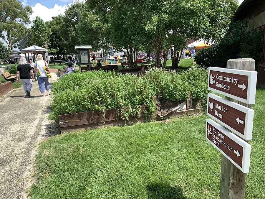 community gardens sign and walkway