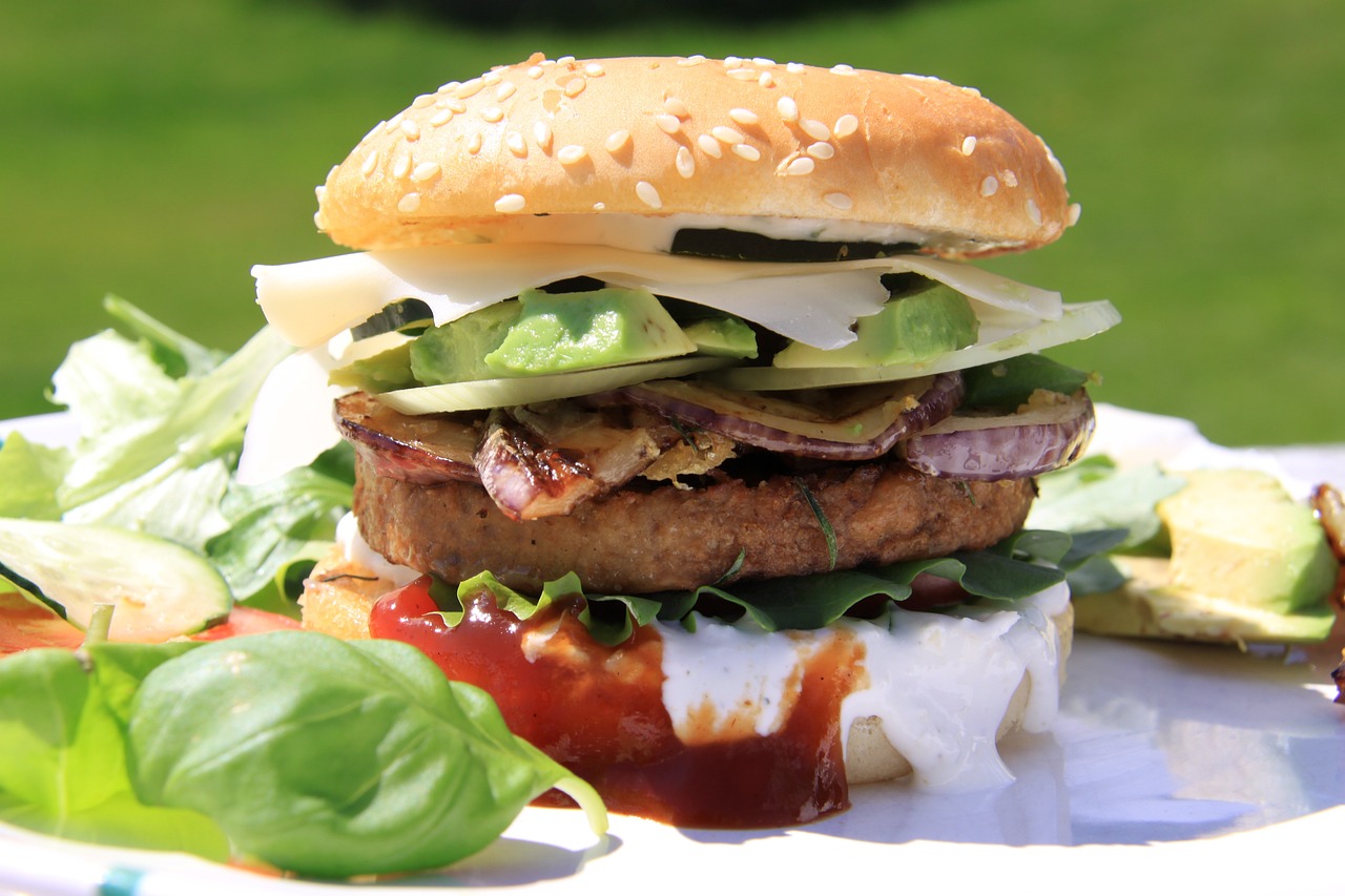 Big chickpea burger on a seeded bun with lettuce and tomato