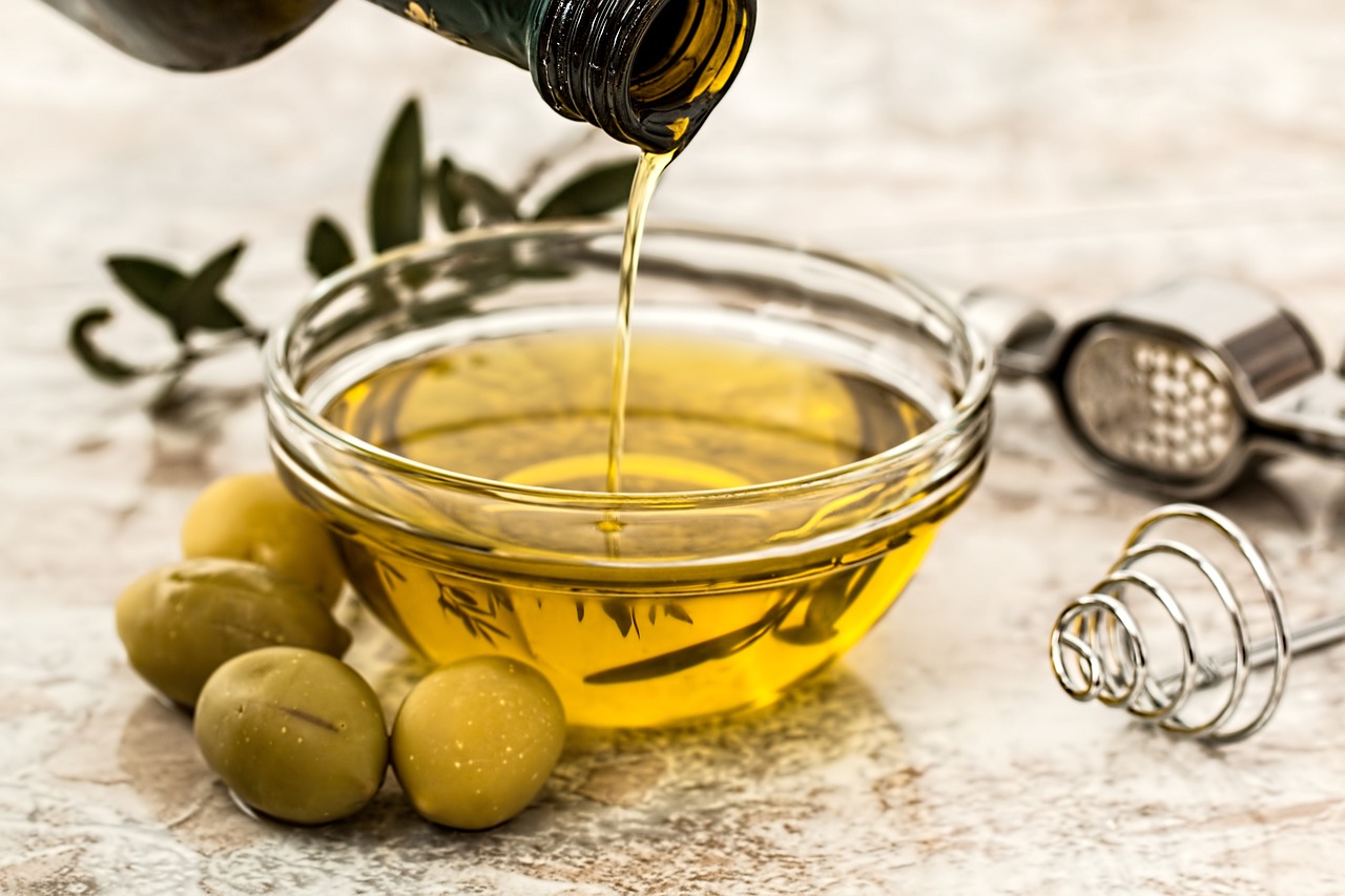Olive oil salad dressing in a clear bowl