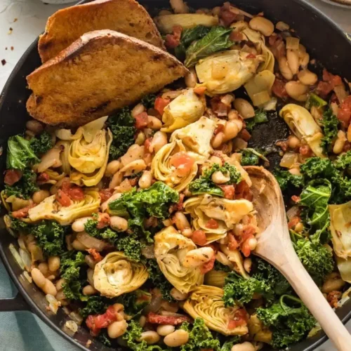 skillet of artichokes, kale, white beans, sundried tomatoes
