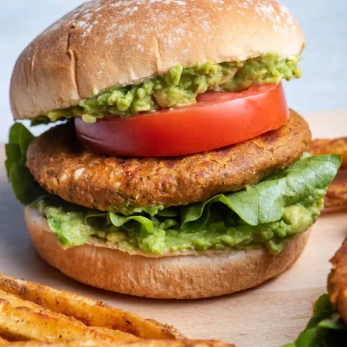 chickpea burger with tomato and lettuce on seeded roll