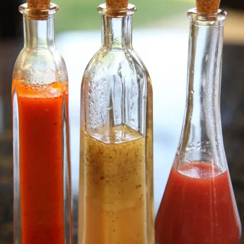 3 fresh salad dressings in tall bottles