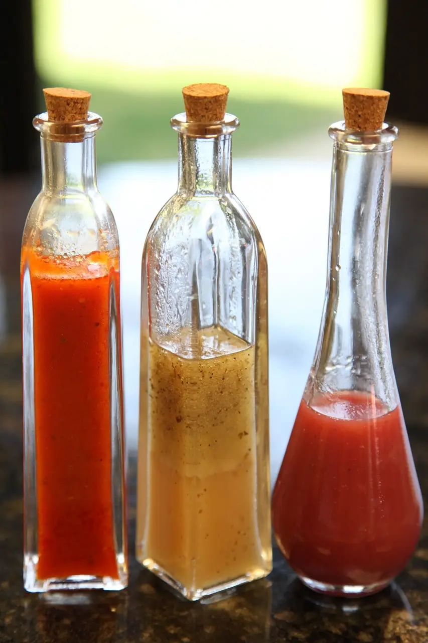 3 fresh salad dressings in tall bottles