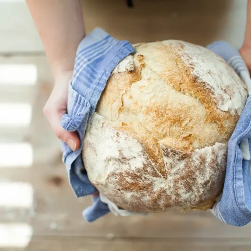 fresh bread presented in a blue towel