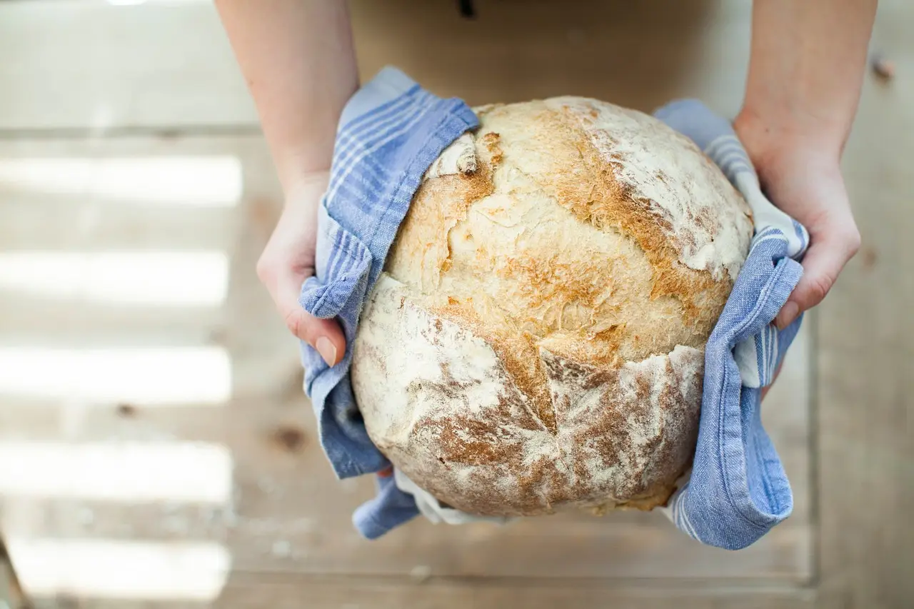 fresh bread presented in a blue towel