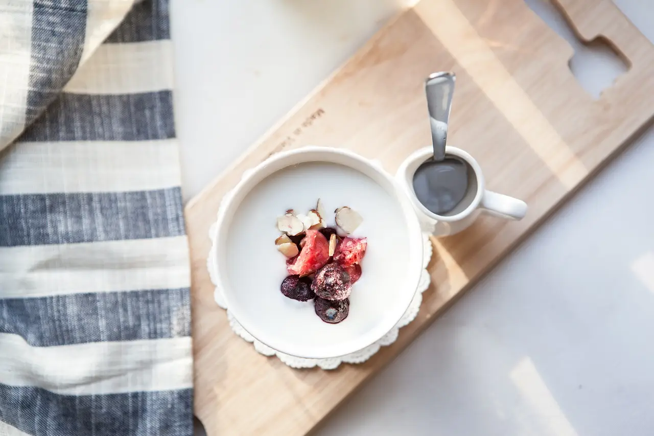yogurt with fruit in a white bowl