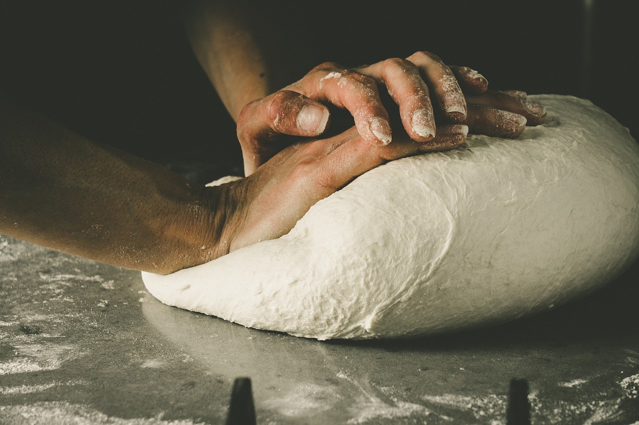 kneading pizza dough